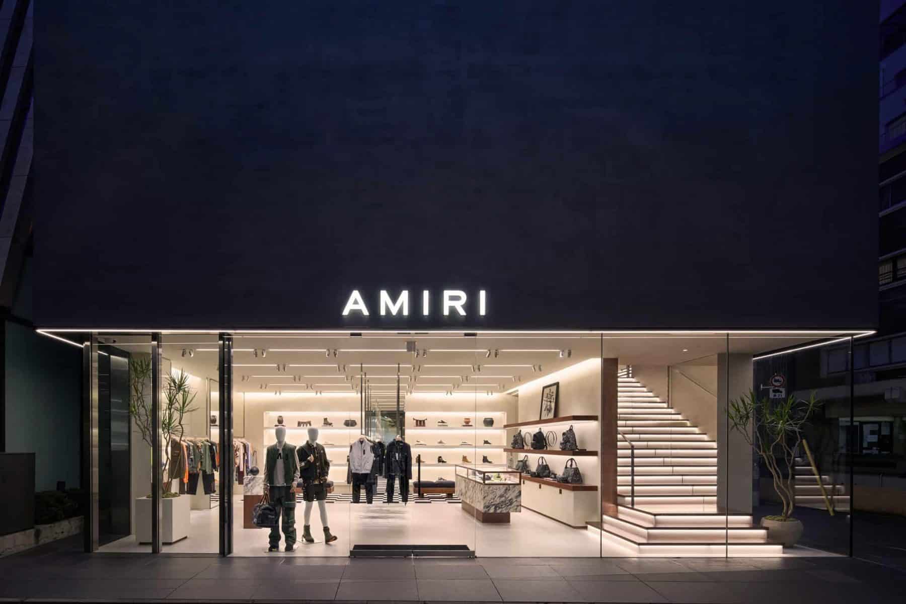 AMIRI Tokyo Aoyama flagship store facade featuring minimalist clear glass architecture.