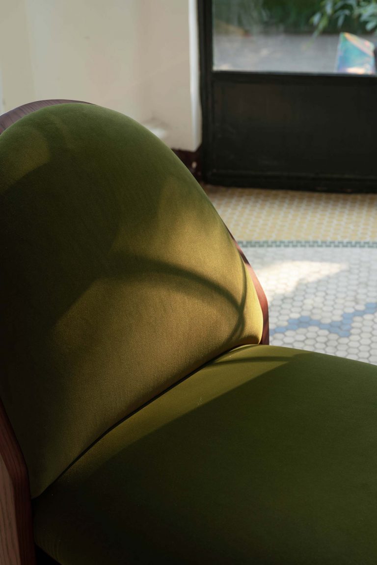 Close-up detail of the LANDSCAPE Armchair backrest — olive green mohair velvet and smoked oak frame trim. NOCOD Studio for HOTHING.