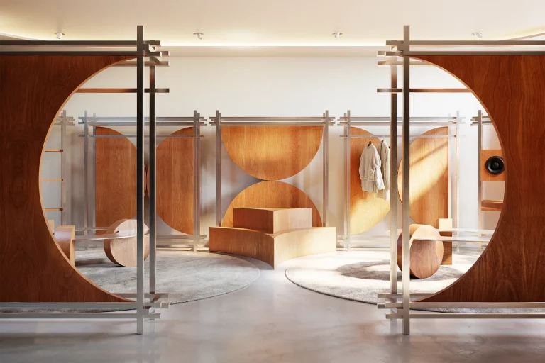 Pop-Up Store by NOCOD Studio — entrance view through oval oak panel cutout. Circular retail architecture with metal rail system and geometric wood volumes.