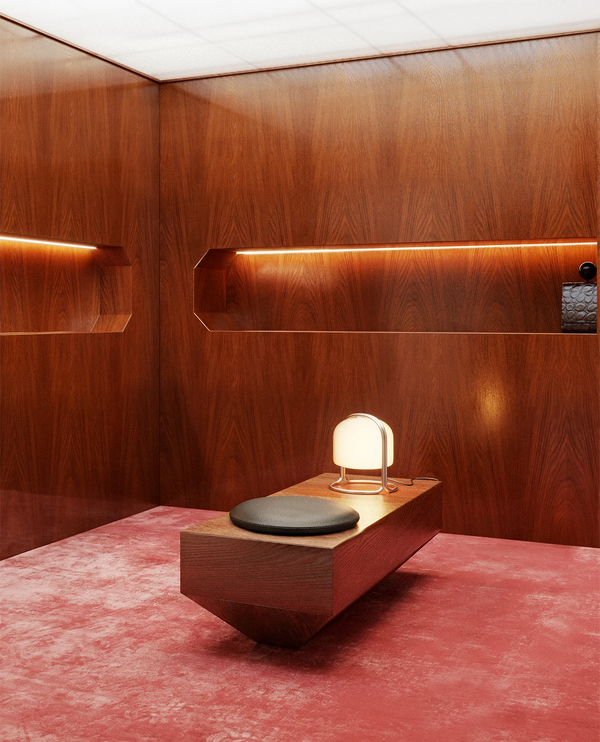 NOVU concept store by NOCOD Studio — private listening booth. Warm oak panels, LED recessed niche, custom bench with black leather cushion, deep rose velvet carpet